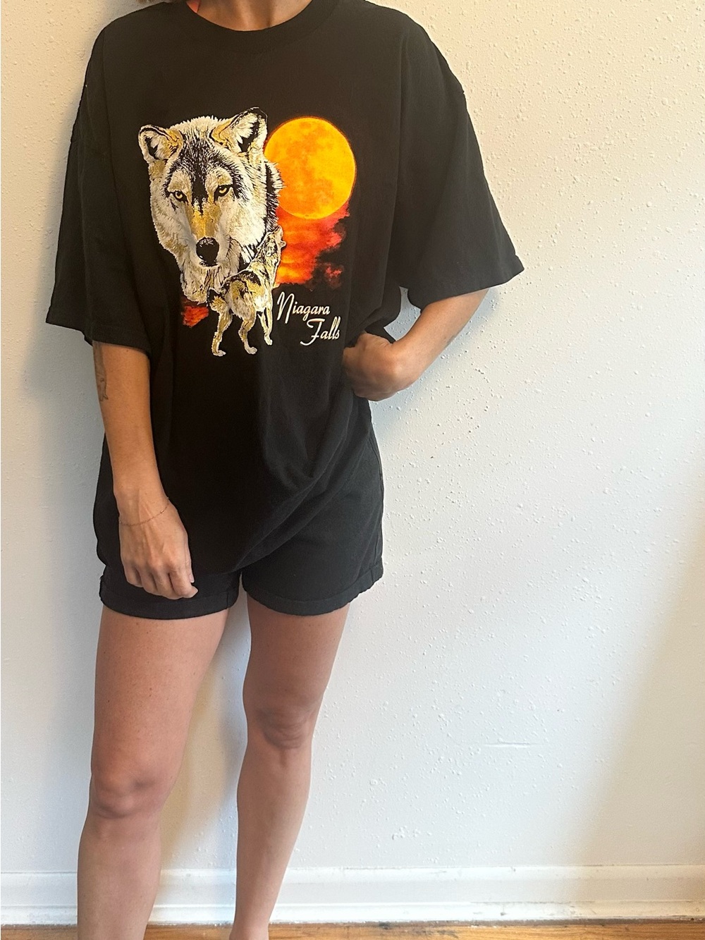 Vintage Black Wolf Graphic Tee with Orange Moon